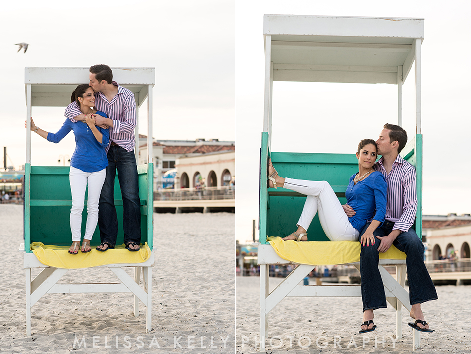 Ocean City engagement photo on beach with lifeguard stand.