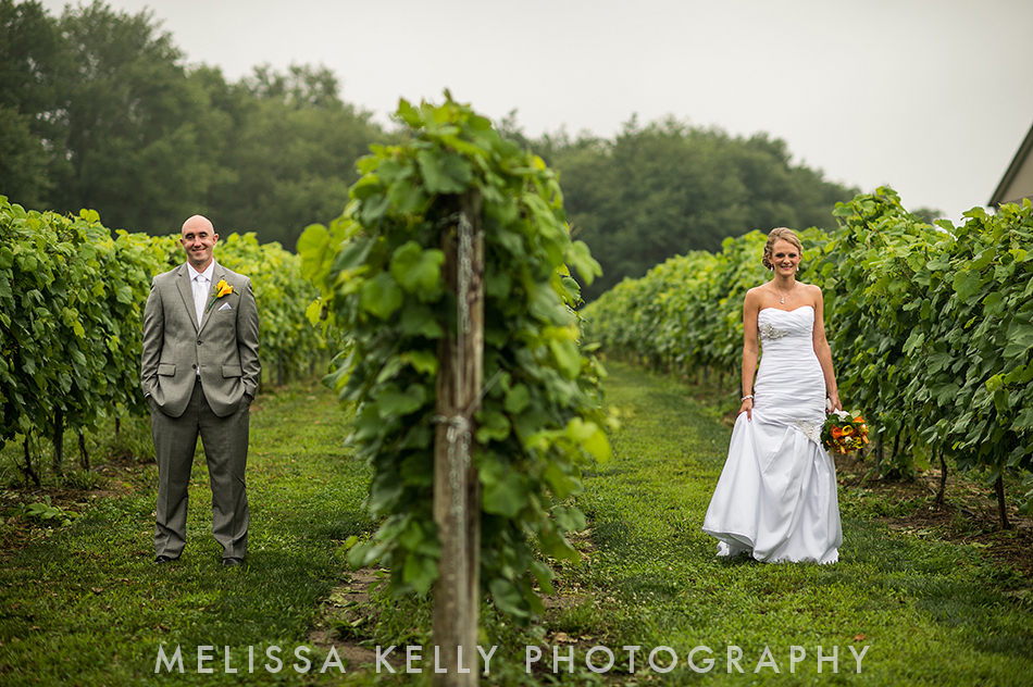 bride and groom in vineyard for first look
