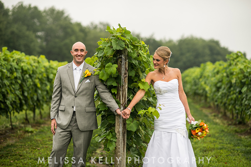 bride and groom in vineyard for first look